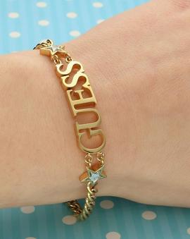 Pulsera GUESS dorada con 2 estrellas cristal Swarovski